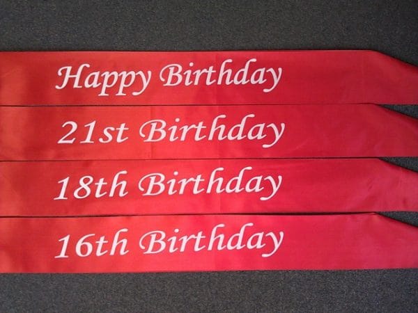 Happy Birthday Red Sashes Sash With White Print - image Red-sashs-600x450 on https://www.abracadabrafancydress.com.au